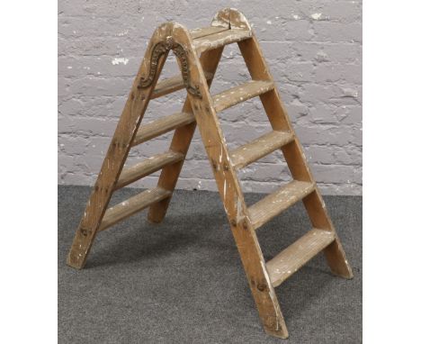 A Simplex double five rung step ladder. 