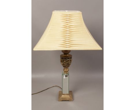 A bevel edge glass column table lamp. 