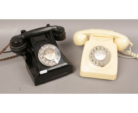 A black bakelite vintage dial telephone and a cream vintage BT GPO 746 rotary dial telephone. 