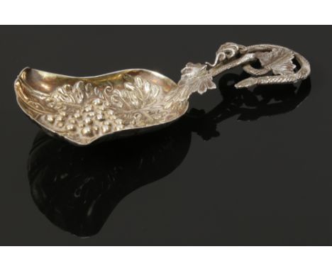 A Victorian ornate silver caddy spoon, assayed Birmingham 1853. 