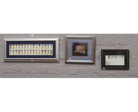 Four framed World War II medals to include framed Royal Mail Gallantry first day cover and framed collectors cards for Britis