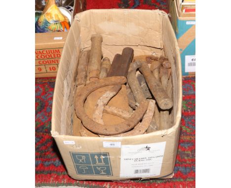 A box of vintage hand tools to include horse shoes. 