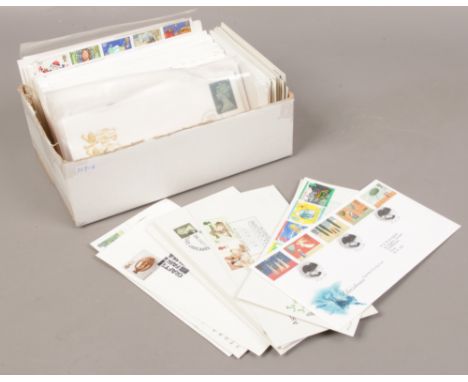 A box of first day covers, souvenir cards and the National Postal Museum postcards. 