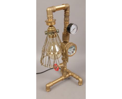 Steampunk style brass pipe table lamp. 