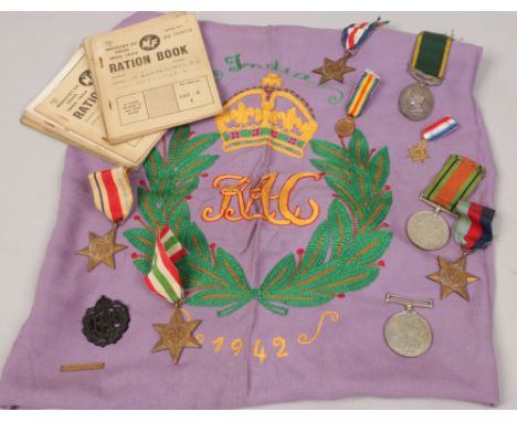 A group of military medals to include 1939-45 Star, Italy Star, African Star, France - Germany Star, defense medal, efficient