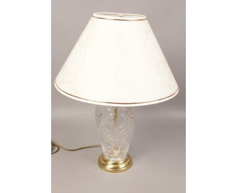 A brass and cut glass table lamp. 