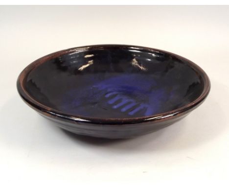 TREVOR CORSER.
A large Trevor Corser shallow bowl. Diameter 36.5cm. Impressed personal mark & Leach Pottery mark.
Sold on beh