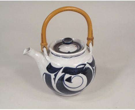 ALDERMASTON POTTERY.
An Aldermaston Pottery cane handle teapot by Julian Belmont. Height 25cm. incl. handle. Signed with mono