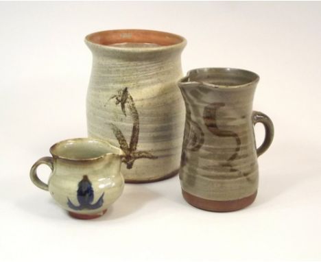 LEACH POTTERY.
A Leach Pottery hakeme decorated jar with plant motifs, 18.5cm (probably lacks lid), a jug with painted decora
