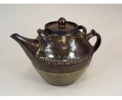 ABUJA POTTERY.
A large, quart-size Abuja Pottery, Nigeria teapot by Peter Gboko. Width 30cm. Impressed personal & Pottery mar