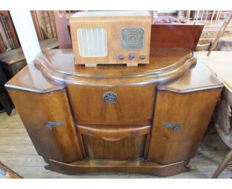 A 1930's Walnut cocktail cabinet and a mains vintage radio