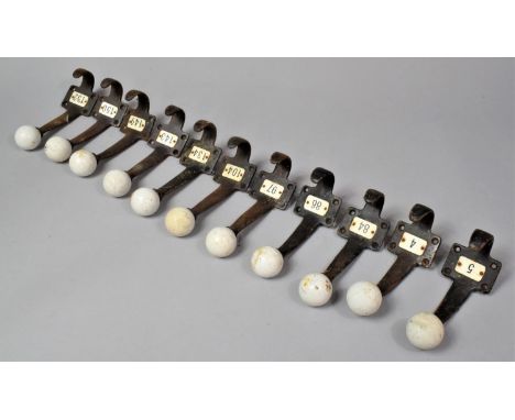 A Collection of Eleven Vintage Numbered Hat and Coat hooks, Each 16cm high 
