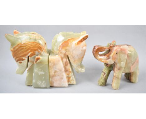 A Pair of Onyx Horseheads Bookends and a Carved Onyx Elephant with Trunk in Salute, Bookends 16cm high 