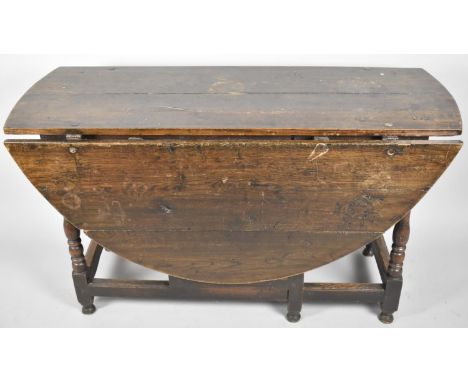 A Mid 19th Century Oak Oval Topped Drop Leaf Gate Legged Dining Table, on Turned Supports with Drawers Either End, 128cm Long