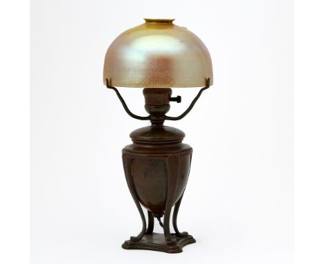 Circa 1915The domed shade in translucent amber colored glass cased with an opaque white glass lining, engraved on the fitter 