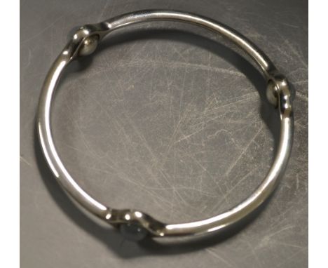 A George Jensen silver and three stone bangle, pattern 473, impressed marks