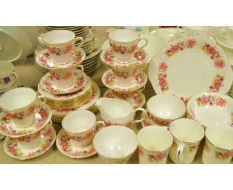 A Colclough pottery tea service decorated with a honey suckle floral design; pattern G671, printed marks. 