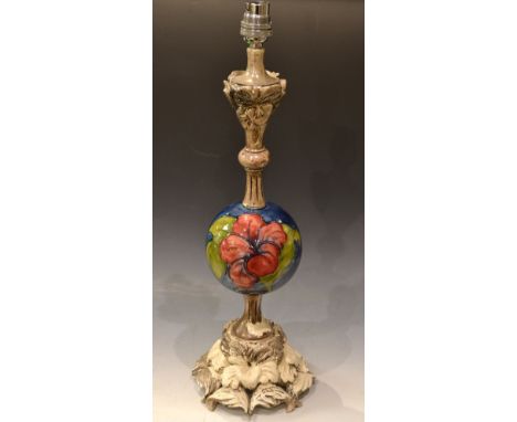 An unusual table lamp with spherical Moorcroft mount, typically tube lined. 