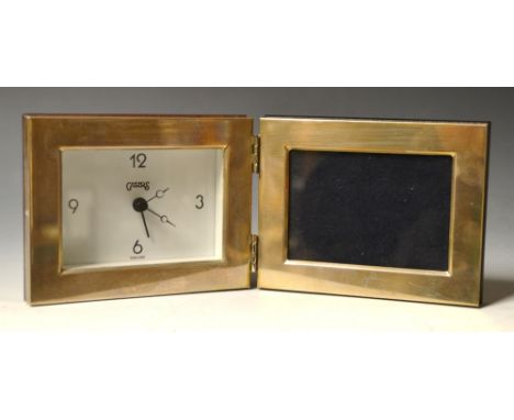 A contemporary silver travelling alarm clock by Carr's England, as a folding photograph frame, Sheffield 2001. 