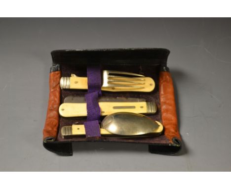 An Edwardian travelling pocket picnic set, comprising folding knife, fork and spoon, leather case