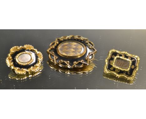 An early Victorian black enamel and hairwork mourning brooch, engraved and dated 1840 to verso, unmarked yellow metal mount; 