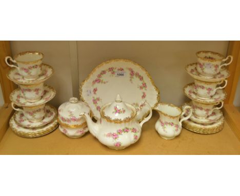 A Royal Albert Dimity Rose pattern tea set, comprising tea pot, milk and sugar, butter dish and cover, six tea cups, saucers 