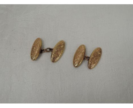 A pair of vintage 9ct gold cufflinks having engraved oval panels with chain connectors,  approx 4.1g