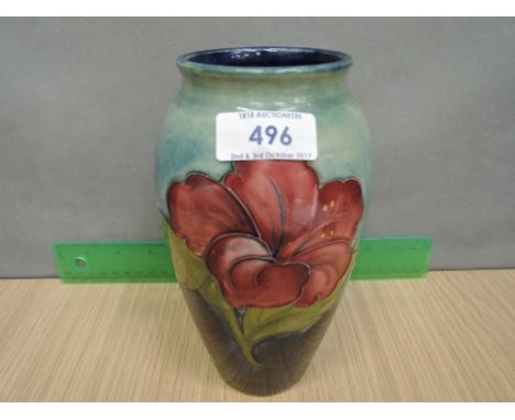 A Moorcroft vase in hibiscus pattern on shaded blue ground, signed and labelled 