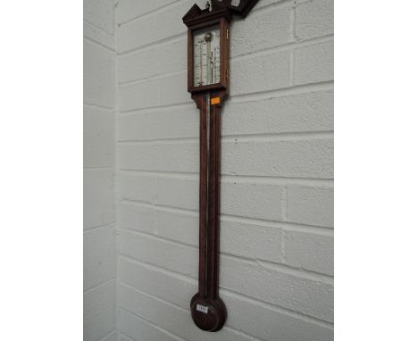 A mahogany period style stick barometer by Comotti, Holborn 