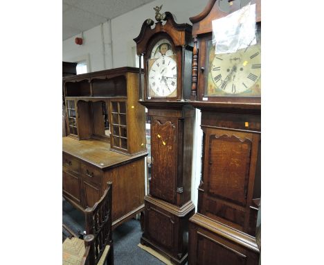 A late 18th century mahogany and oak longcase clock having brass finial swan neck reeded pillar hood, containing arch painted