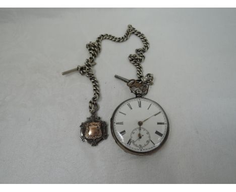 A Victorian key wound pocket watch having Roman numeral dial with subsidiary seconds in an engine turned case, London 1862, J