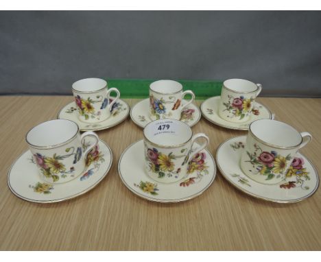 A Wedgwood china coffee service comprising six cups and saucers having floral pattern