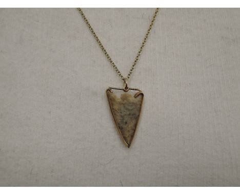 A pendant formed out of an ancient fish harpoon head said to have been found off the Arabian Gulf coast in the 1960's, mounte