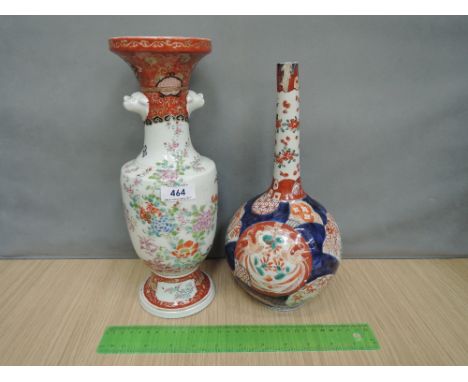 A Japanese Imari vase of bottle shape having typical palette, and a Chinese vase having mask handle and foliate decoration