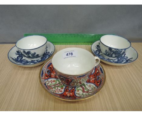 A pair of late 18th century Worcester style tea bowls and saucers in the mother and child pattern and an early 19th century O