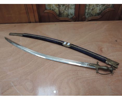 An Indian sword with engraving on blade and ornamental scabbard