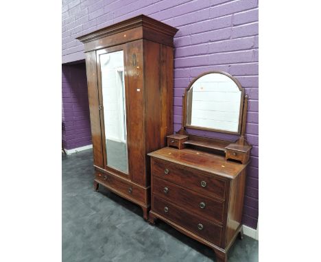 An Edwardian mahogany bedroom suite having line, string and swag inlay decoration, comprising mirror door wardrobe and dressi