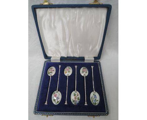 A cased set of silver teaspoons having enamelled wild flower decoration to reverse of bowls and architectural style knops, Bi