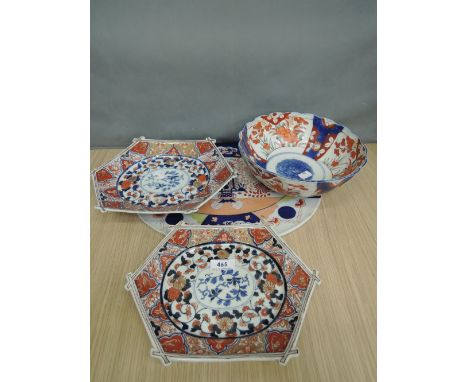 A pair of Japanese Imari dishes of stick design having typical foliate palette, an Imari bowl having band decoration and a 19