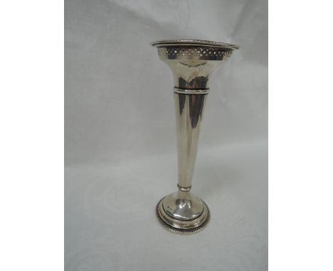 An HM silver bud vase of traditional form having pierced decoration to rim, date mark worn, Sheffield, Walker & Hall