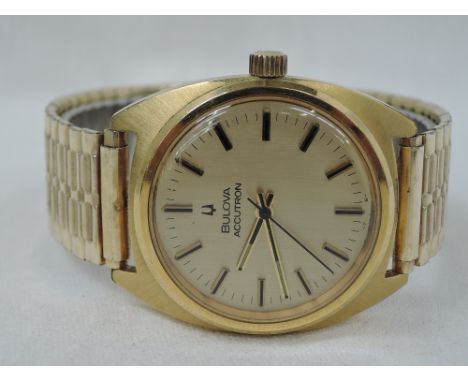 A gents Bulova Accutron wrist watch having baton numeral dial in gold plated case, no: 3-686027, on a later stretch strap