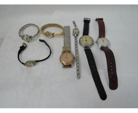 Seven assorted vintage wrist watches including Roamer, Timex, Hoga etc