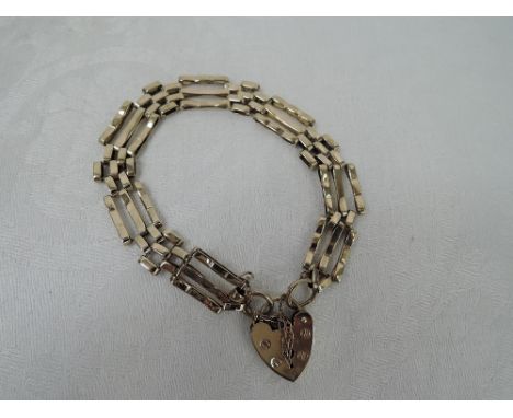 A 9ct gold three bar gate bracelet with padlock clasp,  approx 11.9g
