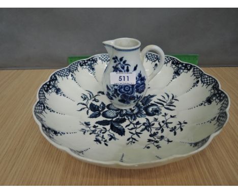A late 18th century Worcester blue and white dish of scallop design having foliate decoration and a similar period Worcester 