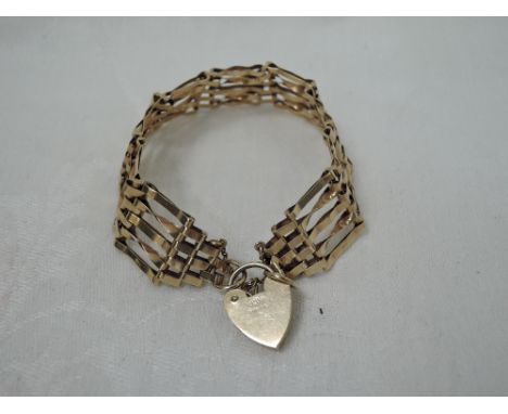 A 9ct gold five bar gate bracelet with padlock clasp,  approx 12.6g