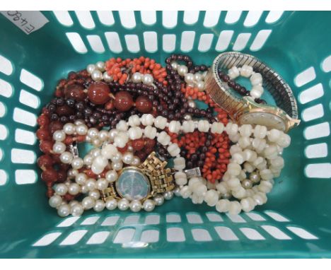 A small selection of costume jewellery including a string of coral branch beads, mother of pearl beads, a lady's Tissot Balla