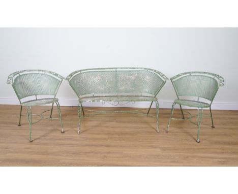 AN EARLY 20TH CENTURY FRENCH GREEN PAINTED GARDEN SUITE (6)The circular table, 123cm diameter; 72cm high and a matched set of