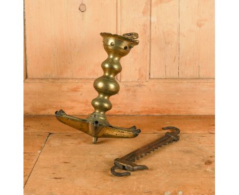 JUDAICA: A JEWISH BRASS SABBATH LAMP WIITH RATCHET HOOK (2)Possibly German, 19th Century
The brass lamp with six burners, the