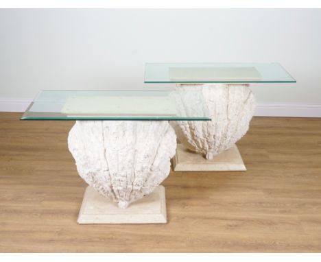 A PAIR OF CONSOLE TABLES WITH GLASS TOPS AND SCALLOP SHELL BASES (2)110cm wide; 46cm deep; 78cm highBases are 65cm wide 78cm 