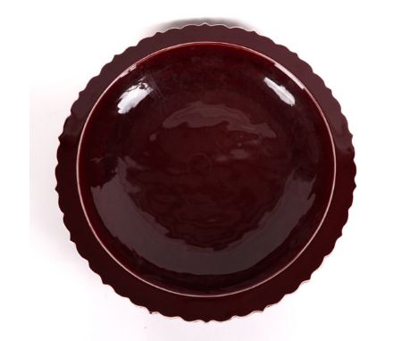 A LARGE SANG DE BEOUF GLAZED CERAMIC BOWLModern
With petal edged flat rim, 58cm diameter